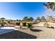 View of a landscaped yard overlooking the golf course at 2905 Legend Dr, Las Vegas, NV 89134