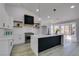 Contemporary kitchen features an island with a breakfast bar, and stainless steel appliances at 2905 Legend Dr, Las Vegas, NV 89134