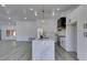 Gourmet kitchen with large center island, stainless appliances, and white cabinetry in open floorplan at 2905 Legend Dr, Las Vegas, NV 89134