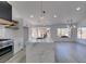 Bright kitchen boasts white cabinets, stainless steel appliances, recessed lighting, and a large island at 2905 Legend Dr, Las Vegas, NV 89134