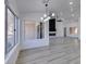 Open-concept living room with large windows and a modern fireplace at 2905 Legend Dr, Las Vegas, NV 89134