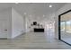 Open-concept kitchen and living room features recessed lighting, light gray floors, and bright white walls at 2905 Legend Dr, Las Vegas, NV 89134