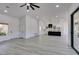 Spacious living room and kitchen area boasts an open floorplan and light gray flooring at 2905 Legend Dr, Las Vegas, NV 89134