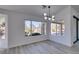 Bright living room featuring large windows that offer views of the landscaped exterior at 2905 Legend Dr, Las Vegas, NV 89134