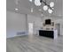 Spacious living room with modern lighting that flows into the updated kitchen at 2905 Legend Dr, Las Vegas, NV 89134