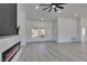 Bright living room boasts recessed lighting, modern fireplace, and light gray floors throughout the open floorplan at 2905 Legend Dr, Las Vegas, NV 89134