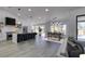 Bright open living room with bar seating and natural light at 2905 Legend Dr, Las Vegas, NV 89134