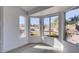 Bright sun room with beautiful views of the landscaped backyard and mature trees at 2905 Legend Dr, Las Vegas, NV 89134