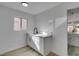 A wet bar featuring white cabinets and granite countertops at 2905 Legend Dr, Las Vegas, NV 89134