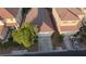 Aerial view of a well-maintained home featuring a two-car garage and mature trees in the front yard at 3532 Mountain Park St, Las Vegas, NV 89129