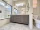 Modern bathroom with a gray vanity, dual sinks, and tiled shower-over-tub at 3532 Mountain Park St, Las Vegas, NV 89129