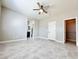 Spacious bedroom boasts ample natural light, ceiling fan, and easy access to en suite bathroom and walk-in closet at 3532 Mountain Park St, Las Vegas, NV 89129