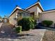 Welcoming front walkway leading to the entrance, enhanced by lush greenery, and decorative rock landscaping at 3532 Mountain Park St, Las Vegas, NV 89129