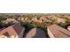 Expansive aerial view displays a residential neighborhood with many trees, homes, and desert landscaping at 3532 Mountain Park St, Las Vegas, NV 89129