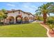Well-manicured backyard showcasing a lush lawn, mature trees, and a luxurious pool area, perfect for relaxation at 38 Pebble Dunes Ct, Las Vegas, NV 89141