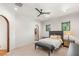 Bright bedroom features modern ceiling fan, ensuite access, and neutral carpeting at 38 Pebble Dunes Ct, Las Vegas, NV 89141