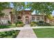 Elegant single-story home featuring manicured landscaping, stone details, and a welcoming entrance at 38 Pebble Dunes Ct, Las Vegas, NV 89141