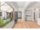 Bright hallway with natural light, showcasing access to the courtyard and the modern, open-concept layout at 38 Pebble Dunes Ct, Las Vegas, NV 89141