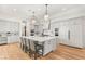 Open kitchen with a large island, modern appliances, and custom cabinetry at 38 Pebble Dunes Ct, Las Vegas, NV 89141