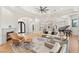 Bright and spacious living room with hardwood floors, a fireplace, and access to the kitchen at 38 Pebble Dunes Ct, Las Vegas, NV 89141