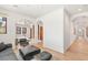 Living room with light hardwood floors, bright arches, and an open floor plan at 38 Pebble Dunes Ct, Las Vegas, NV 89141