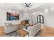 Elegant living room featuring a fireplace, hardwood floors, and large windows at 38 Pebble Dunes Ct, Las Vegas, NV 89141