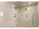 This shower features dual shower heads, hand-held wand and decorative tile accents at 38 Pebble Dunes Ct, Las Vegas, NV 89141