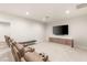 Spacious theater room with carpet and tiered seating, ideal for movie nights and entertainment at 38 Pebble Dunes Ct, Las Vegas, NV 89141
