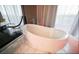 Modern bathroom with a freestanding tub, stylish fixtures, and scenic city views at 4381 W Flamingo Rd # 2902, Las Vegas, NV 89103