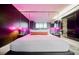 Sleek bedroom with mirrored headboard, ambient lighting, and built-in nightstands, creating a modern and relaxing atmosphere at 4381 W Flamingo Rd # 2902, Las Vegas, NV 89103