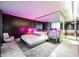 Modern bedroom with accent lighting, mirrored headboard, and built-in nightstands for a sleek and minimalist design at 4381 W Flamingo Rd # 2902, Las Vegas, NV 89103
