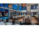 Elegant dining room featuring floor-to-ceiling windows with pool views, modern lighting, and stylish seating at 4381 W Flamingo Rd # 2902, Las Vegas, NV 89103