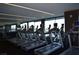 A well-equipped gym features multiple treadmills and large windows providing lots of natural light at 4381 W Flamingo Rd # 2902, Las Vegas, NV 89103