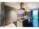 Modern kitchen featuring sleek stainless steel appliances, a center island, and barstool seating with a great view at 4381 W Flamingo Rd # 2902, Las Vegas, NV 89103