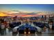 Chic rooftop deck overlooking the Las Vegas strip at sunset with comfortable lounge seating and city views at 4381 W Flamingo Rd # 2902, Las Vegas, NV 89103