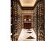 A beautiful wine cellar with floor to ceiling storage and a tiled geometric floor at 4381 W Flamingo Rd # 2902, Las Vegas, NV 89103