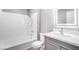 Clean bathroom featuring a shower-tub combo, a modern vanity, and tiled walls at 5000 Red Rock St # 120, Las Vegas, NV 89118