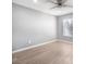 Bright bedroom with a ceiling fan and a large window providing natural light, paired with wood floors at 5000 Red Rock St # 120, Las Vegas, NV 89118