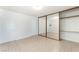 Spacious bedroom with sliding mirror closet doors and neutral color scheme at 5101 Renault Ave, Las Vegas, NV 89142