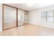 Bedroom with mirrored closet doors, tile flooring and ample natural light at 5101 Renault Ave, Las Vegas, NV 89142