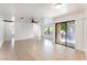 Bright living room featuring tile floors, ceiling fan, and sliding glass door for natural light at 5101 Renault Ave, Las Vegas, NV 89142