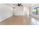 Bright and airy living space featuring tile floors, ceiling fan, and neutral paint at 5101 Renault Ave, Las Vegas, NV 89142
