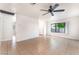 Bright, open-concept living space with tile floors and large windows for natural light at 5101 Renault Ave, Las Vegas, NV 89142