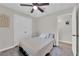 Cozy bedroom featuring neutral walls, double bed, white closet doors and updated floors at 5228 Harmony Ave, Las Vegas, NV 89107
