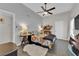 Bright bedroom with stylish decor, ceiling fan, and tiled floors at 5228 Harmony Ave, Las Vegas, NV 89107