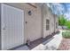 Exterior front door, protective grate, and well maintained landscaping at 5228 Harmony Ave, Las Vegas, NV 89107