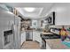 A modern kitchen features white cabinets, stainless steel appliances, and granite countertops at 5228 Harmony Ave, Las Vegas, NV 89107