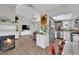 Open-concept living space with fireplace, flows into kitchen with stainless steel appliances at 5228 Harmony Ave, Las Vegas, NV 89107