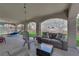 Covered outdoor patio featuring a comfortable seating area and playful splash pad for  at 5228 Harmony Ave, Las Vegas, NV 89107