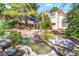Beautiful backyard with a koi pond and lush landscaping and view of the rear exterior at 5381 Waving Sage Dr, Las Vegas, NV 89149